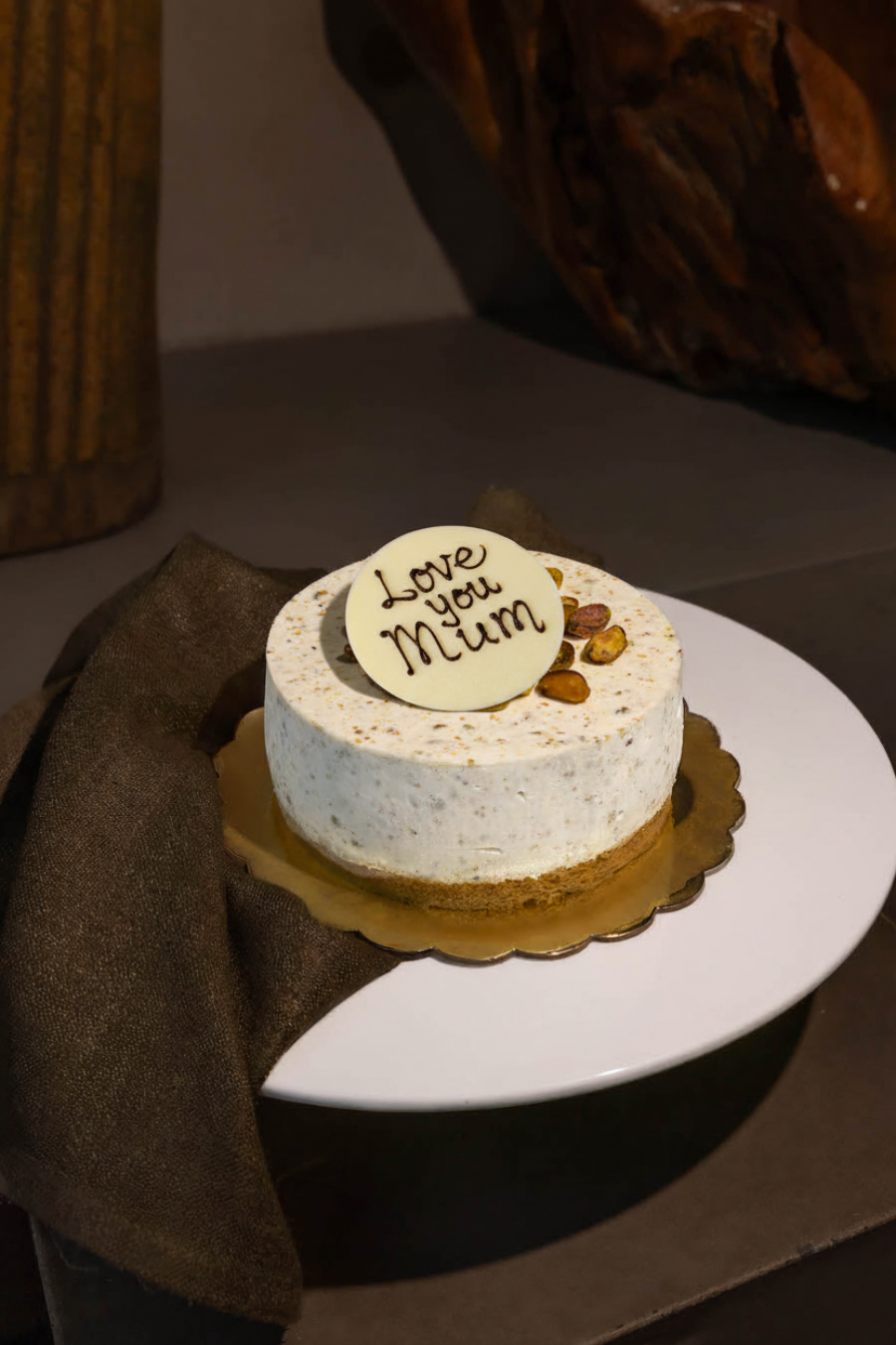 Pistachio Cheesecake with White Choc Plaque