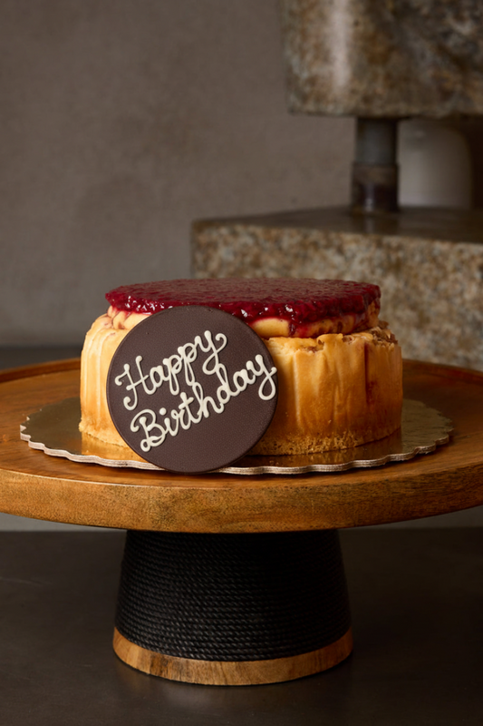 Happy Birthday plaque on Raspberry Cheesecake